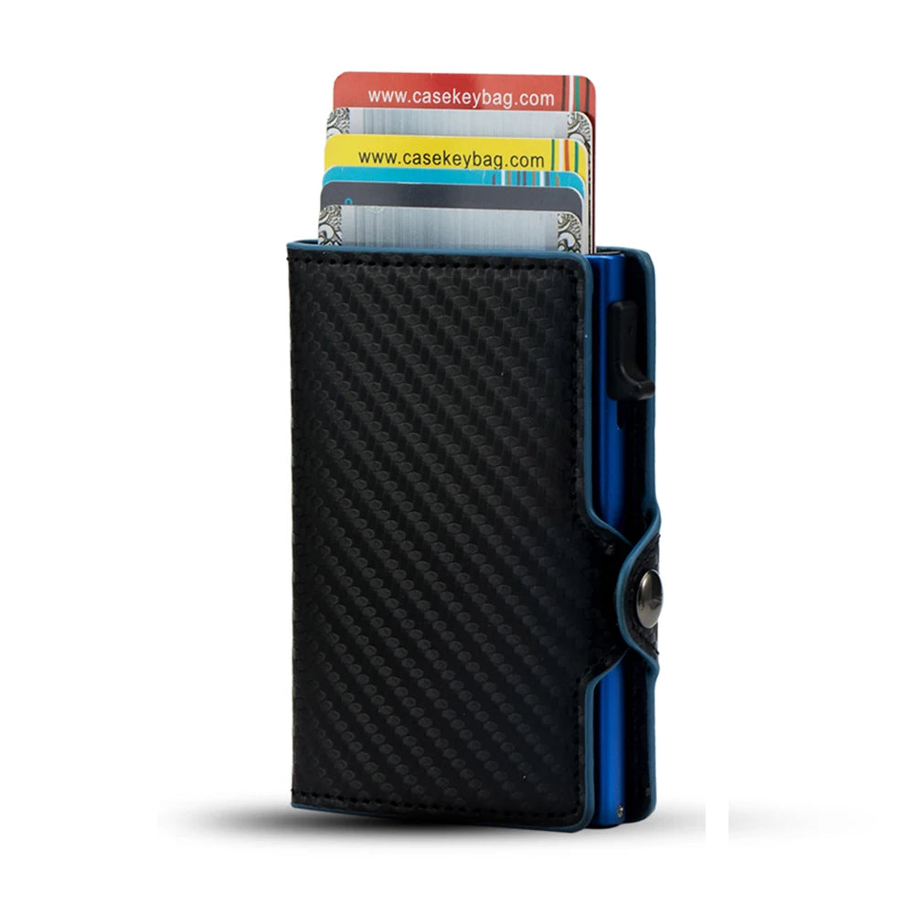 Front view of the black carbon fiber CaseKey cardholder highlighted by a deep blue anodized aluminum metal edge track and pop-up button mechanism