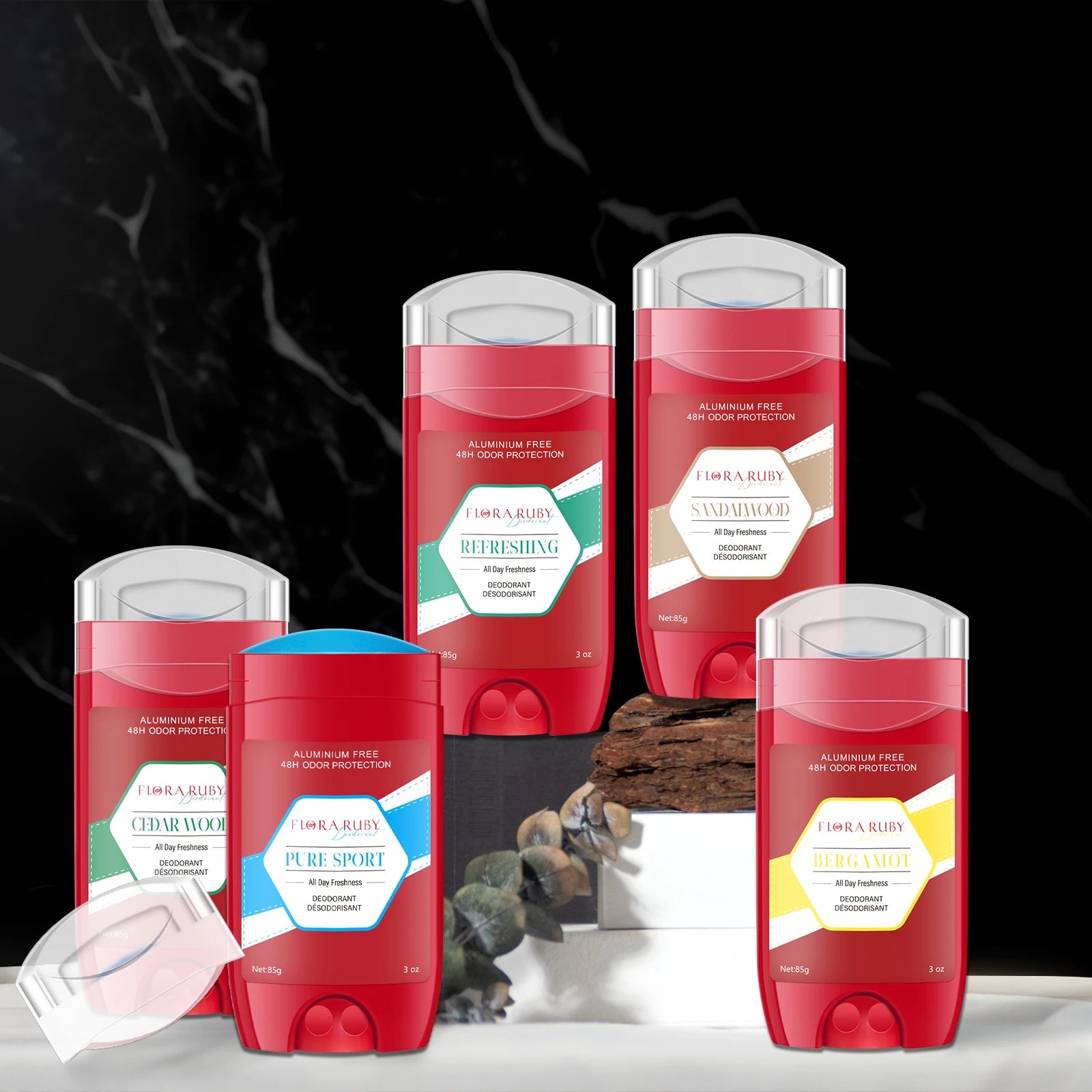 A group of Flora Ruby deodorant sticks arranged elegantly on dark marble blocks showcasing multiple fragrance variations
