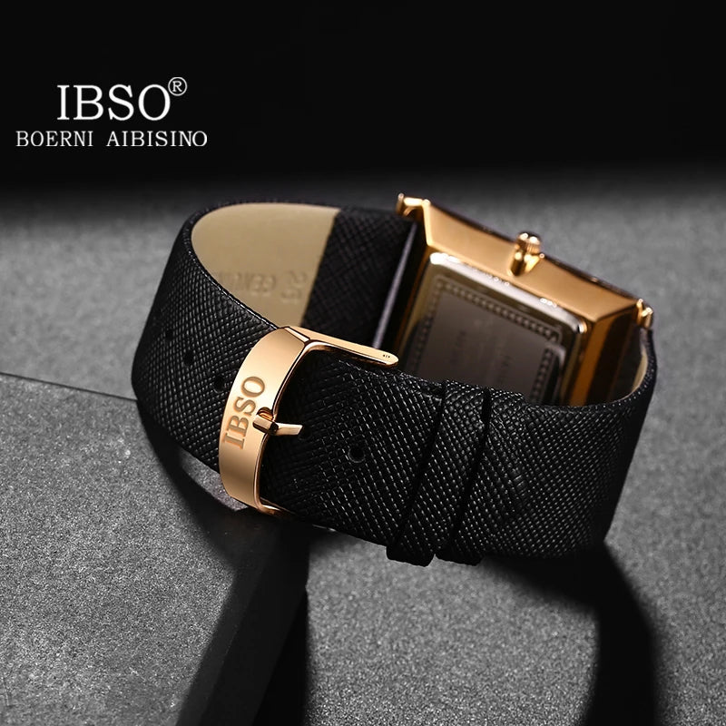Close-up studio view of the golden buckle clasp and micro-textured black leather strap of an IBSO ultra-thin business watch
