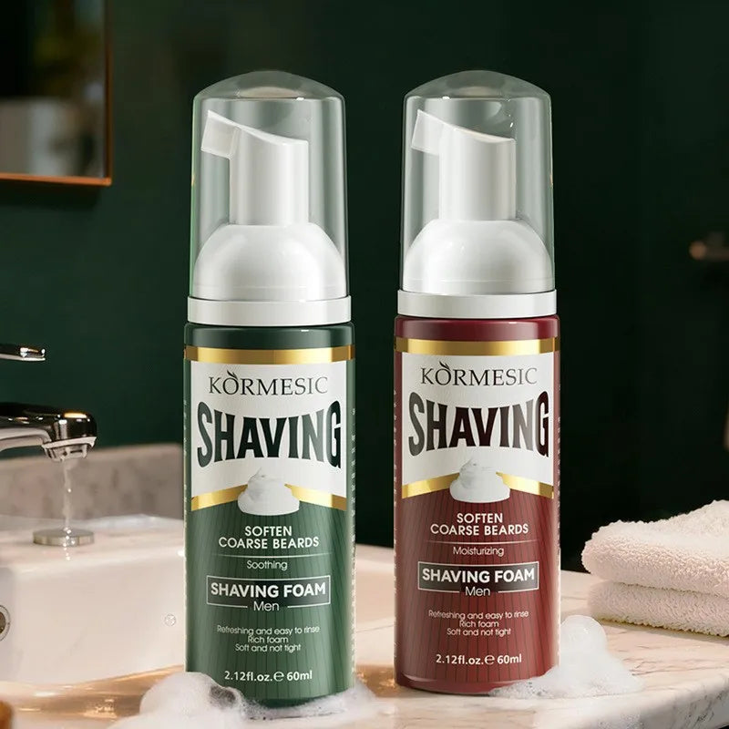 Green and red bottles of Kormesic shaving foam sitting on a luxury bathroom vanity counter