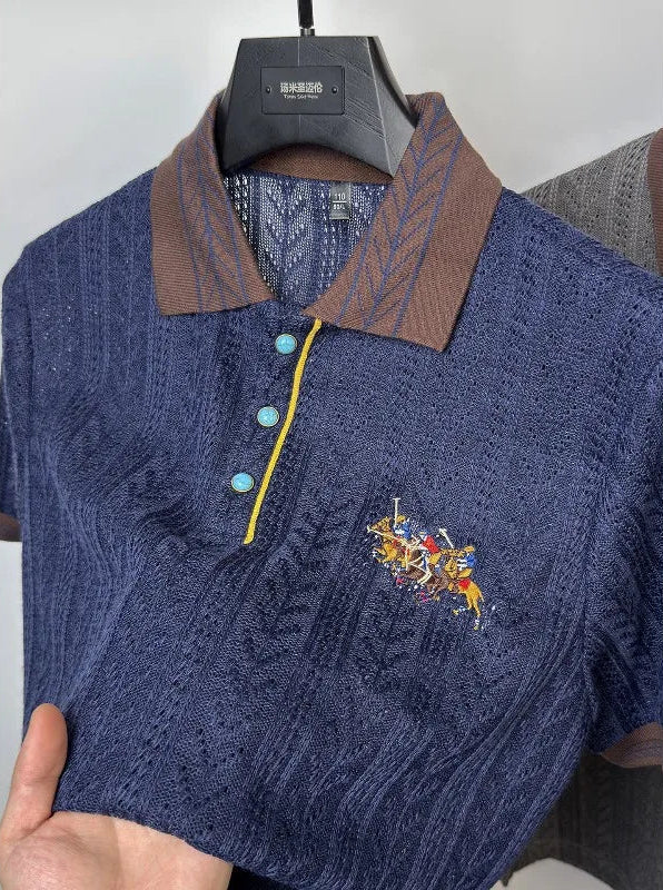 Close-up showing the flexible performance stretch and soft comfort open-weave texture of the navy blue knit polo