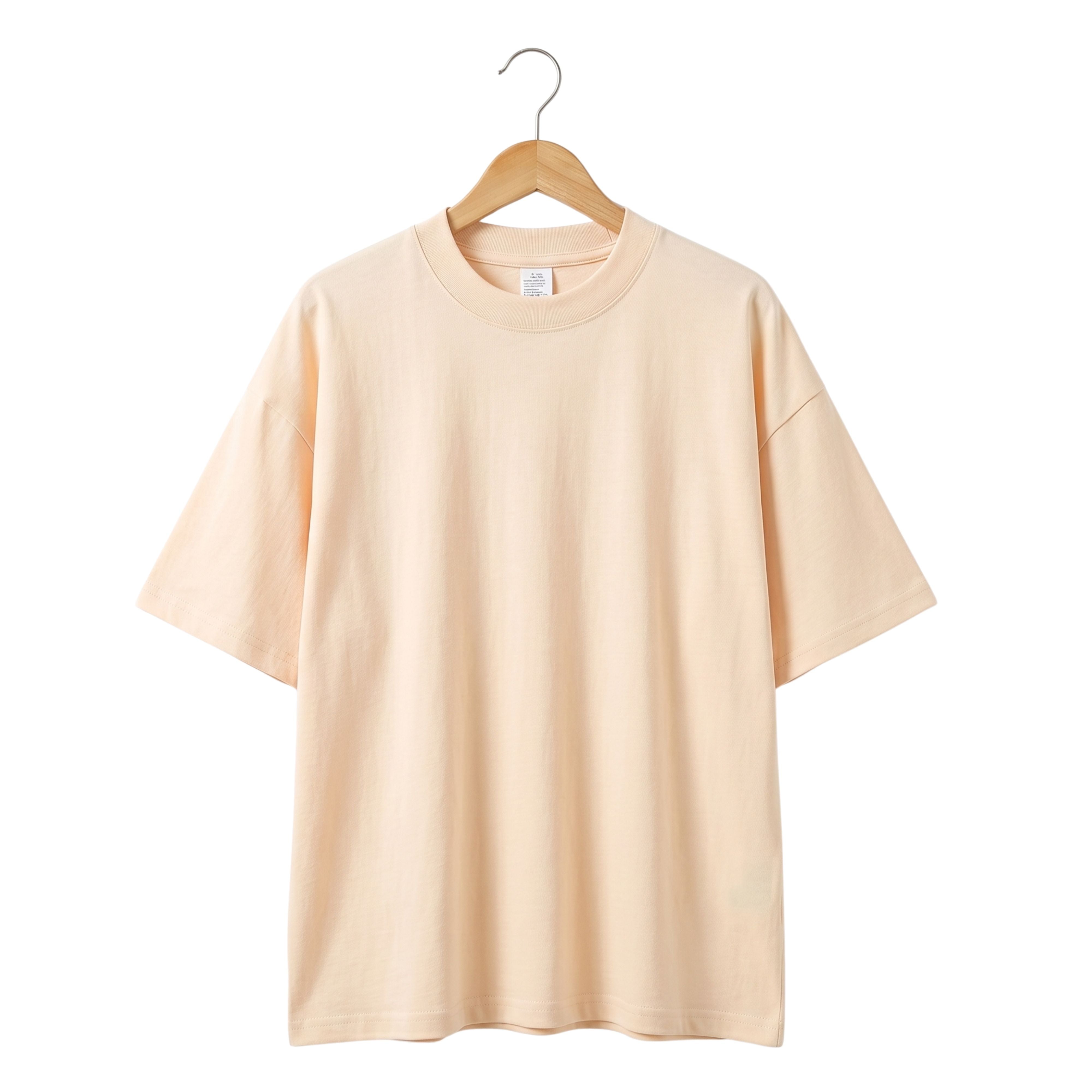 Modern oversized streetwear half-sleeve t-shirt in solid apricot beige tone made from high-density premium cotton