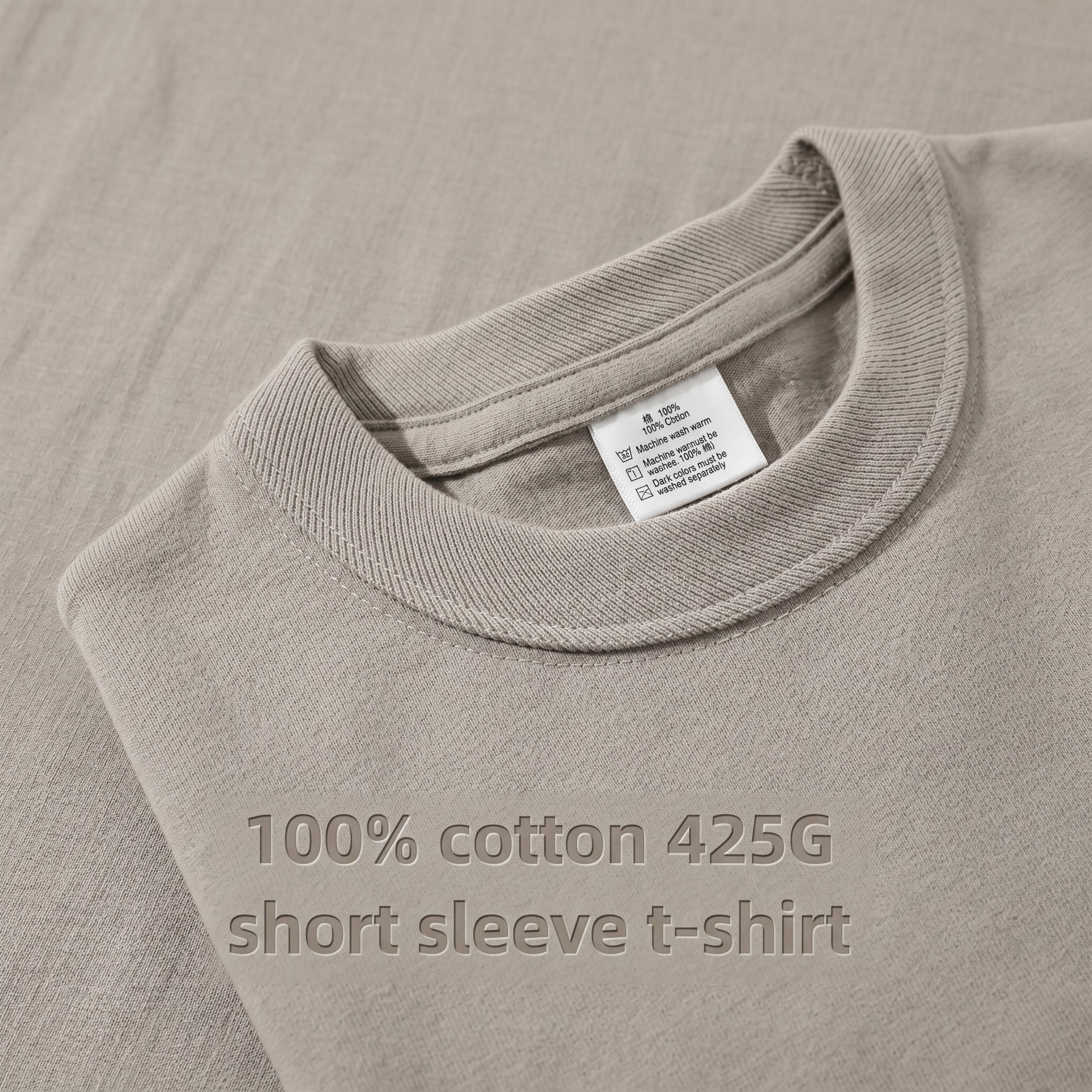 Macro flat lay detail of a khaki beige t-shirt collar showcasing the premium 100% cotton 425G short sleeve t-shirt fabric texture and inner size tag