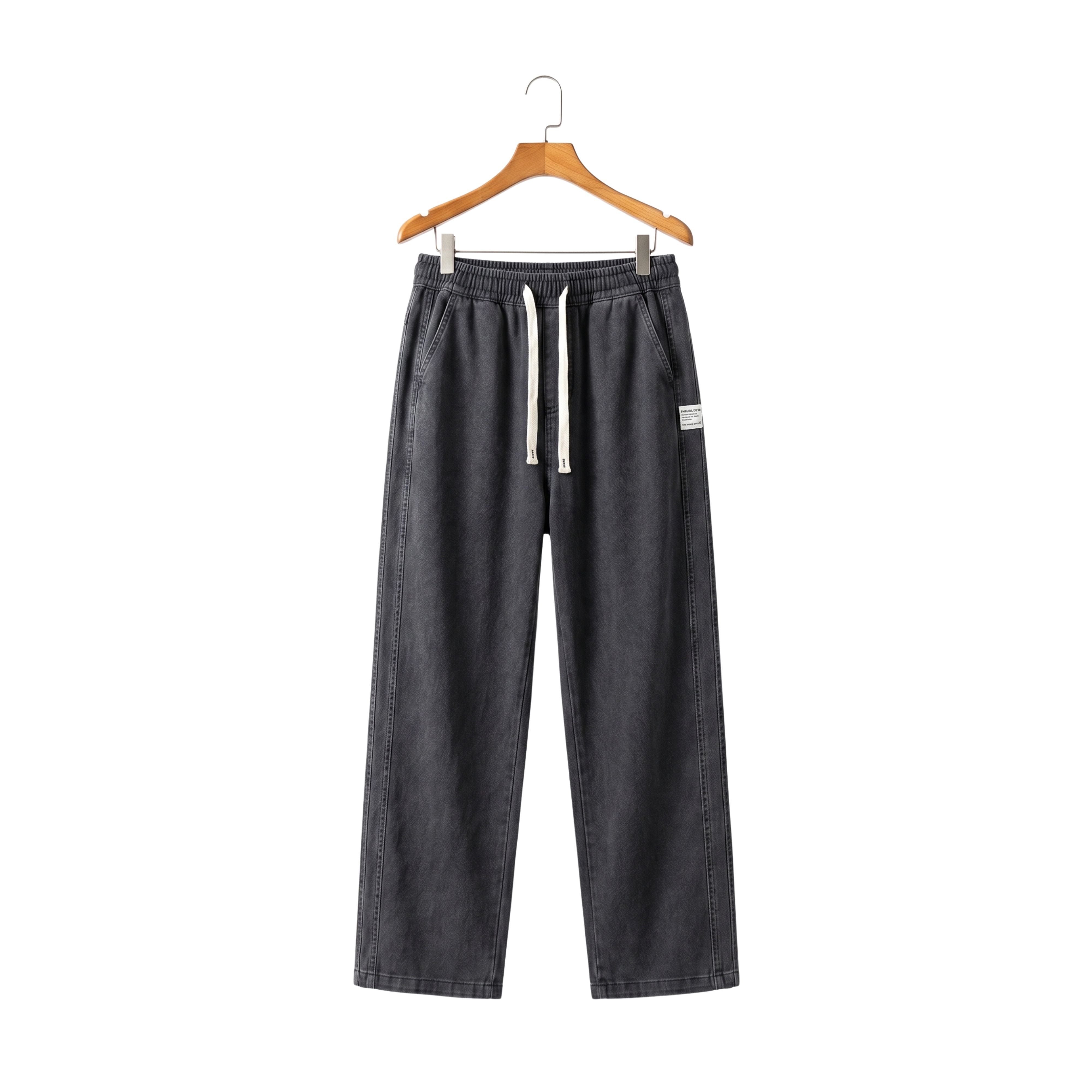 Dark gray loose-fit men's summer jeans made of soft Lyocell fabric featuring an elastic waist and white drawstring on a hanger
