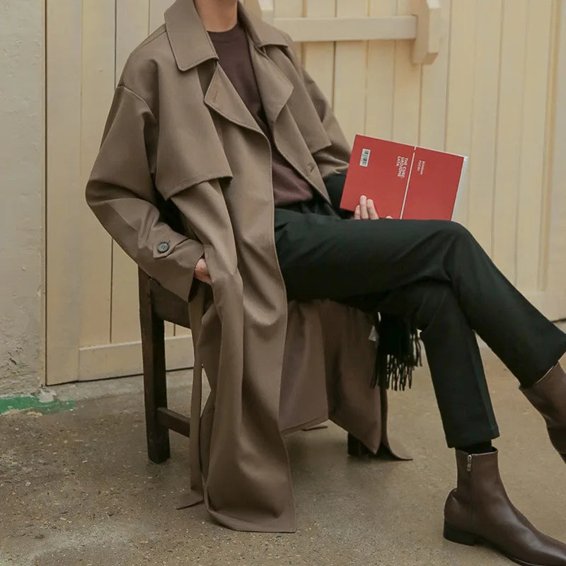 Model wearing relaxed fit men's oversized brown trench coat in korean fashion style