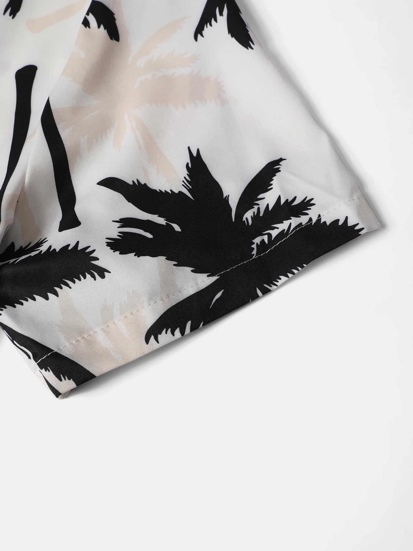 Macro close-up shot of the thin polyester vacation shirt, highlighting the relaxed open lapel collar structure, clean stitching, and front button closure
