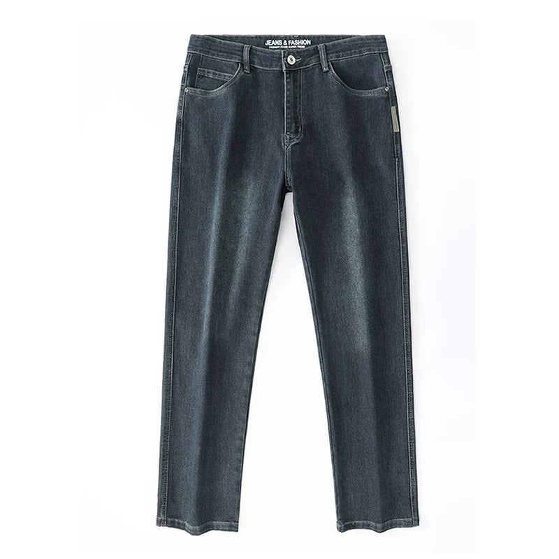 Studio flat lay presentation of the dark vintage blue stretch jeans, showcasing the straight leg cut and flat front panel architecture