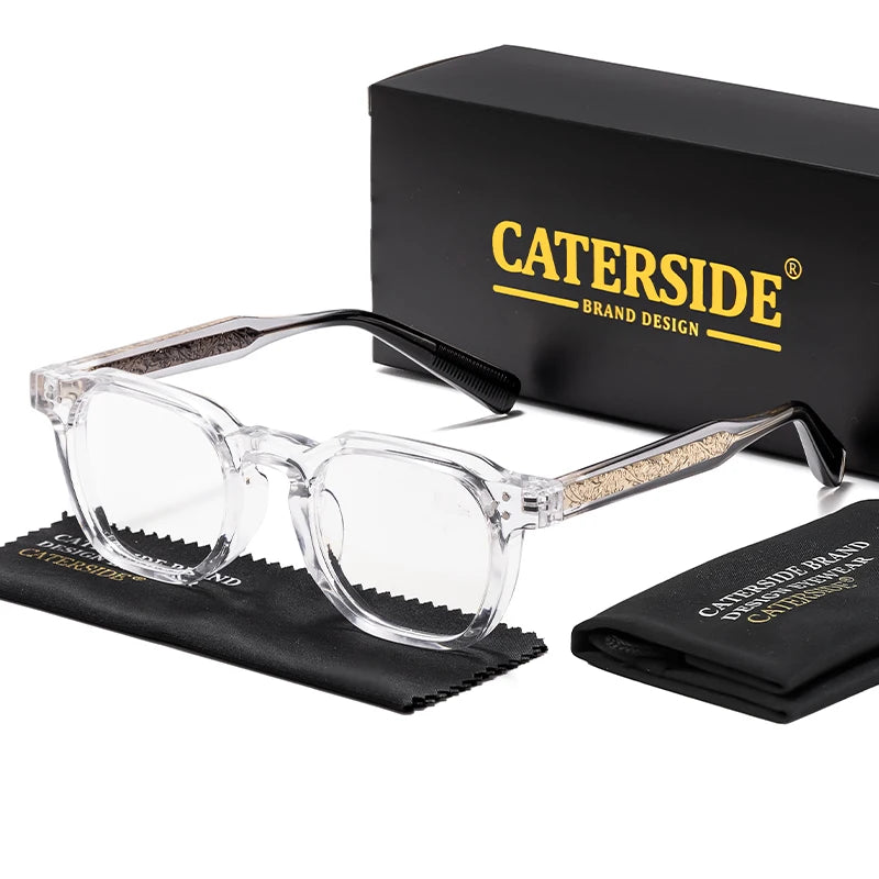 Clear transparent Caterside eyeglass frames displayed alongside the official branded black presentation box and cleaning cloth.