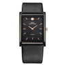 IBSO ultra-thin rectangular men's quartz watch featuring a dark grey alloy case, minimalist black face with rose gold indices, and a black textured leather strap