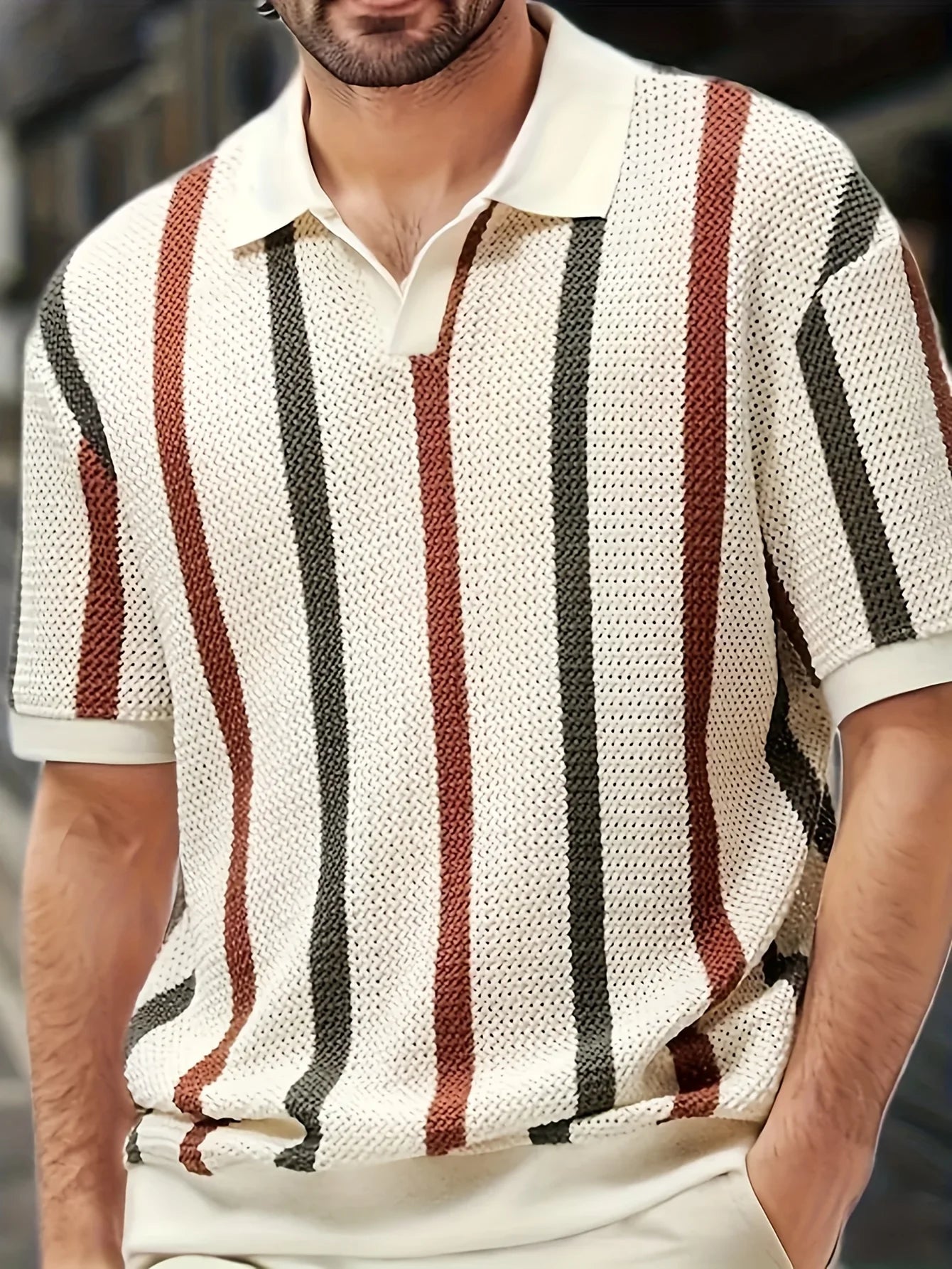 Full front shot of a man styling the cream vertical striped hollow out polo shirt for a premium summer outfit