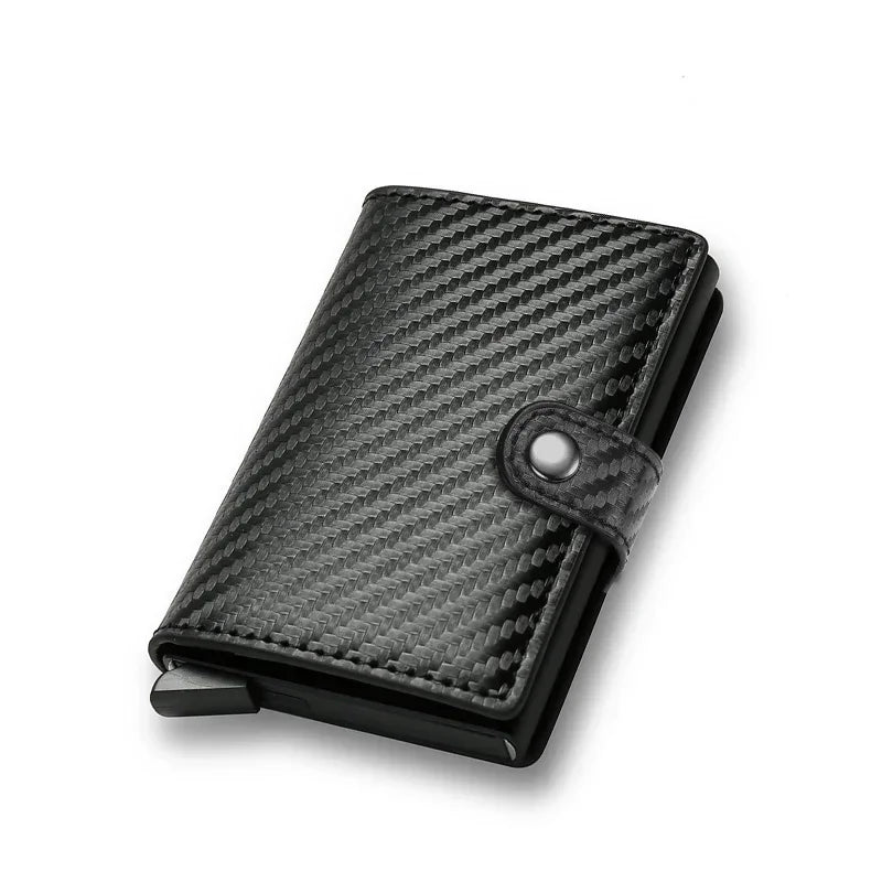 Stealth black carbon fiber textured minimalist wallet with a technical weave finish and an integrated pop-up credit card chamber
