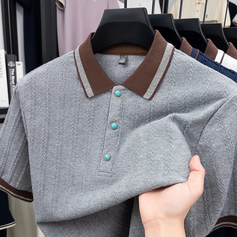 Close-up view of the breathable knit structure and flexible elasticity on the grey jacquard polo shirt.