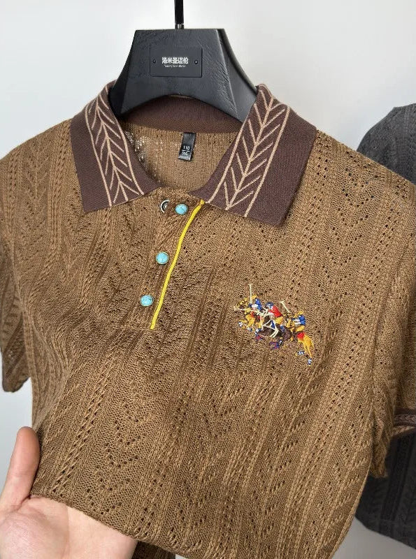 Close-up shot of the detailed brand embroidery and contrast button placket on the brown knit polo shirt