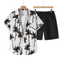 Men's Pacific Wave two-piece summer set featuring a white short-sleeve button-down shirt with a black palm tree print and matching black drawstring shorts
