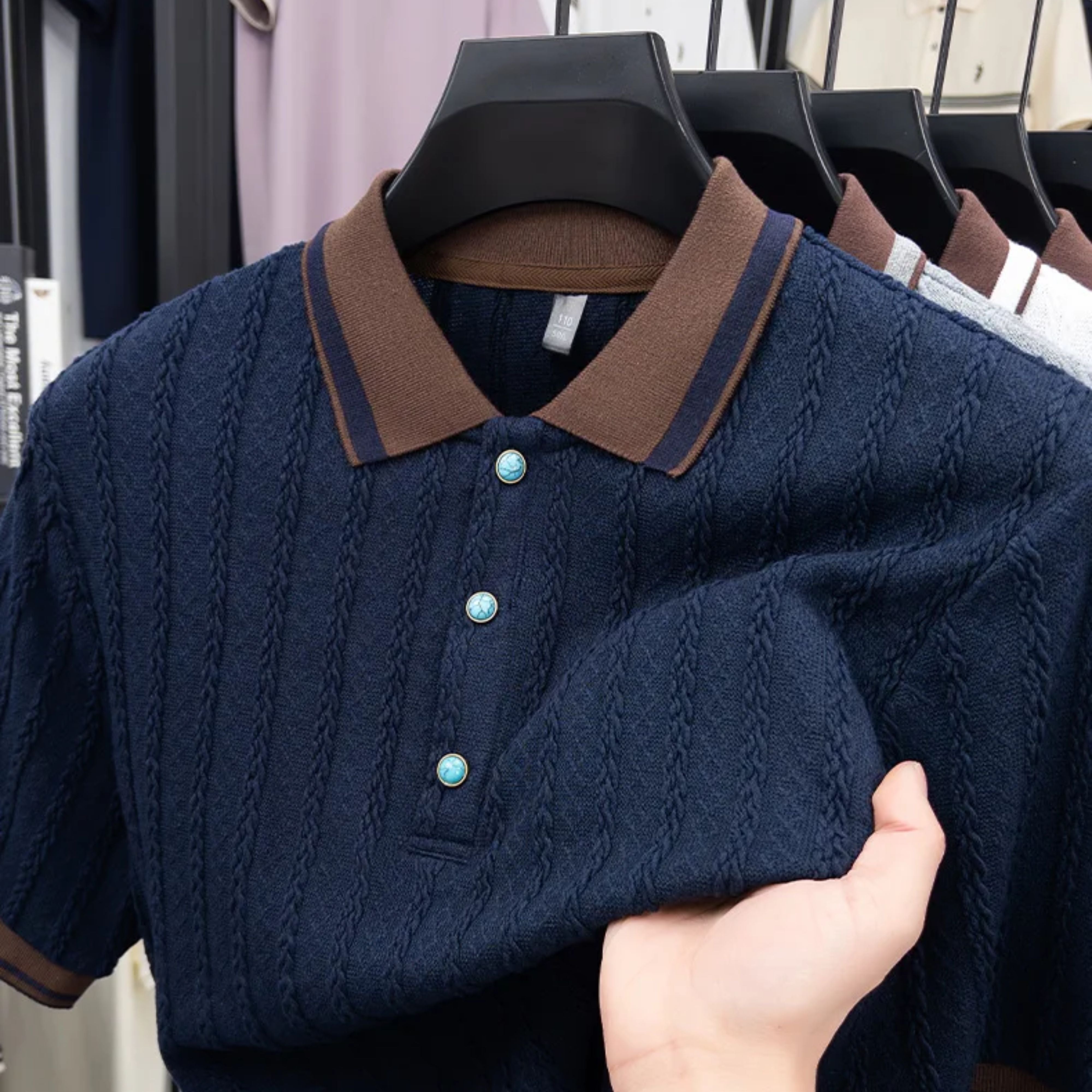 Close-up view of the high-density performance stretch on the navy blue retro mesh-style knit polo shirt