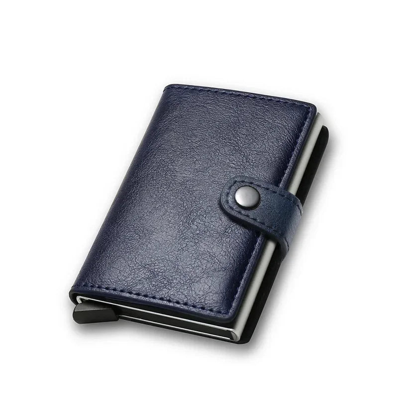 Slim minimalist smart pop-up card holder wallet wrapped in smooth navy blue leather with a silver aluminum inner core