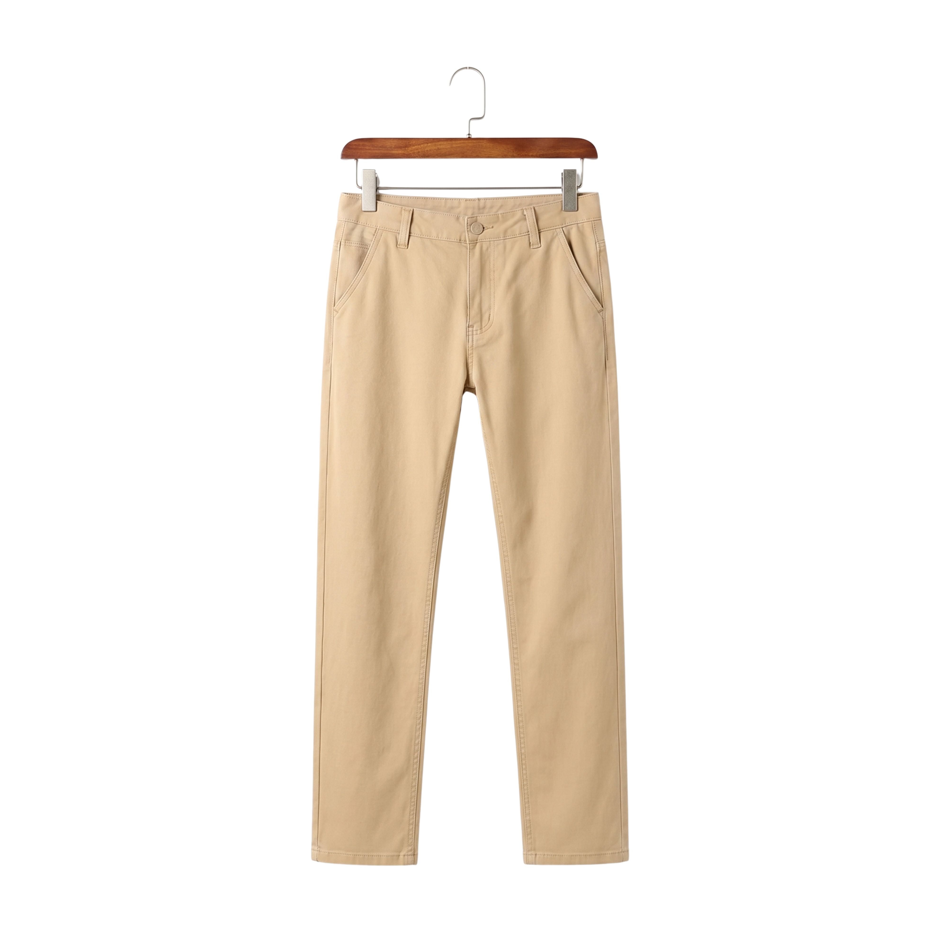Smart casual business male daily trousers in a minimalist sand beige garment wash hanging on a wooden hanger
