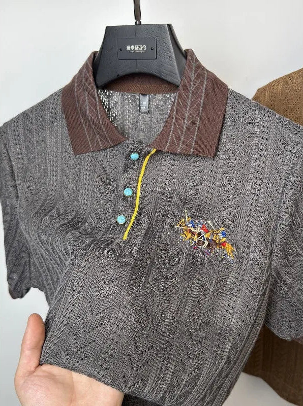 Close-up showcasing the architectural hollowed-out geometric pattern and rich fabric depth of the grey luxury polo