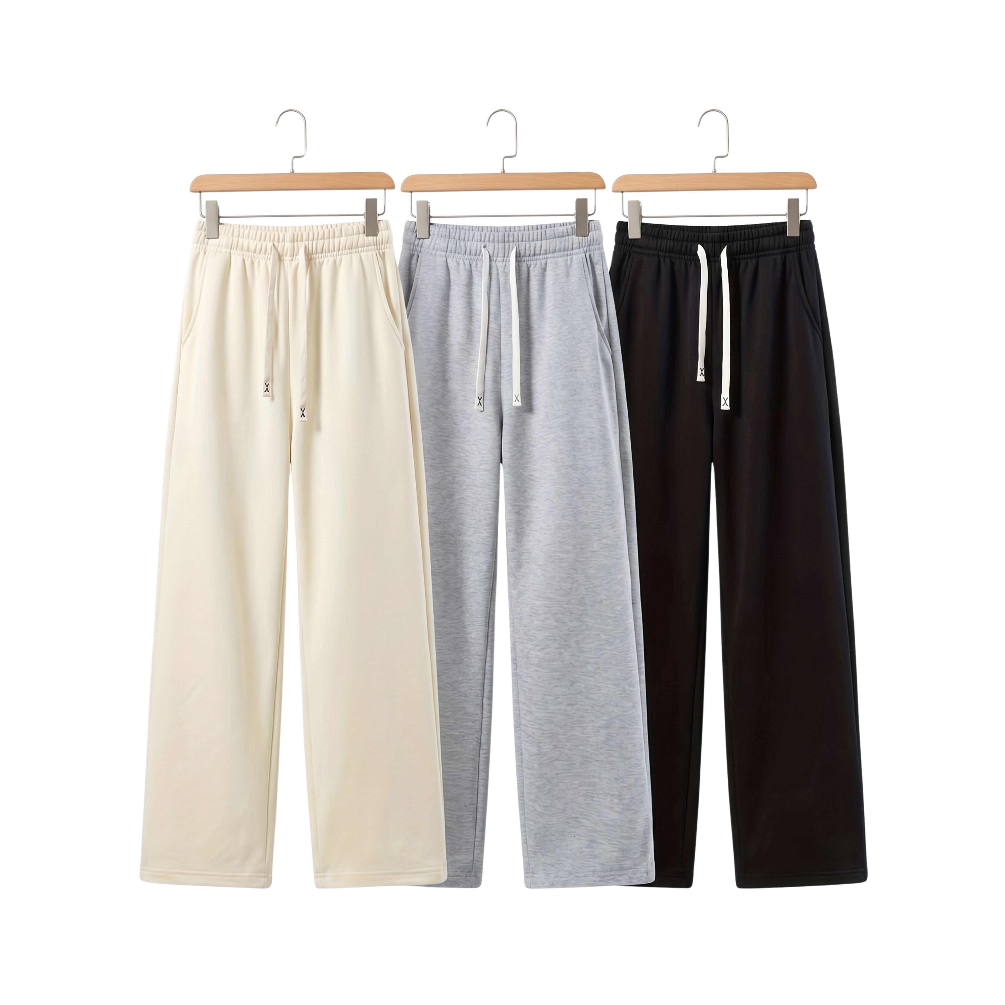 Three pairs of Winthunder men's urban knit versatile jogger sweatpants in cream, heather grey, and black hanging on wooden hangers