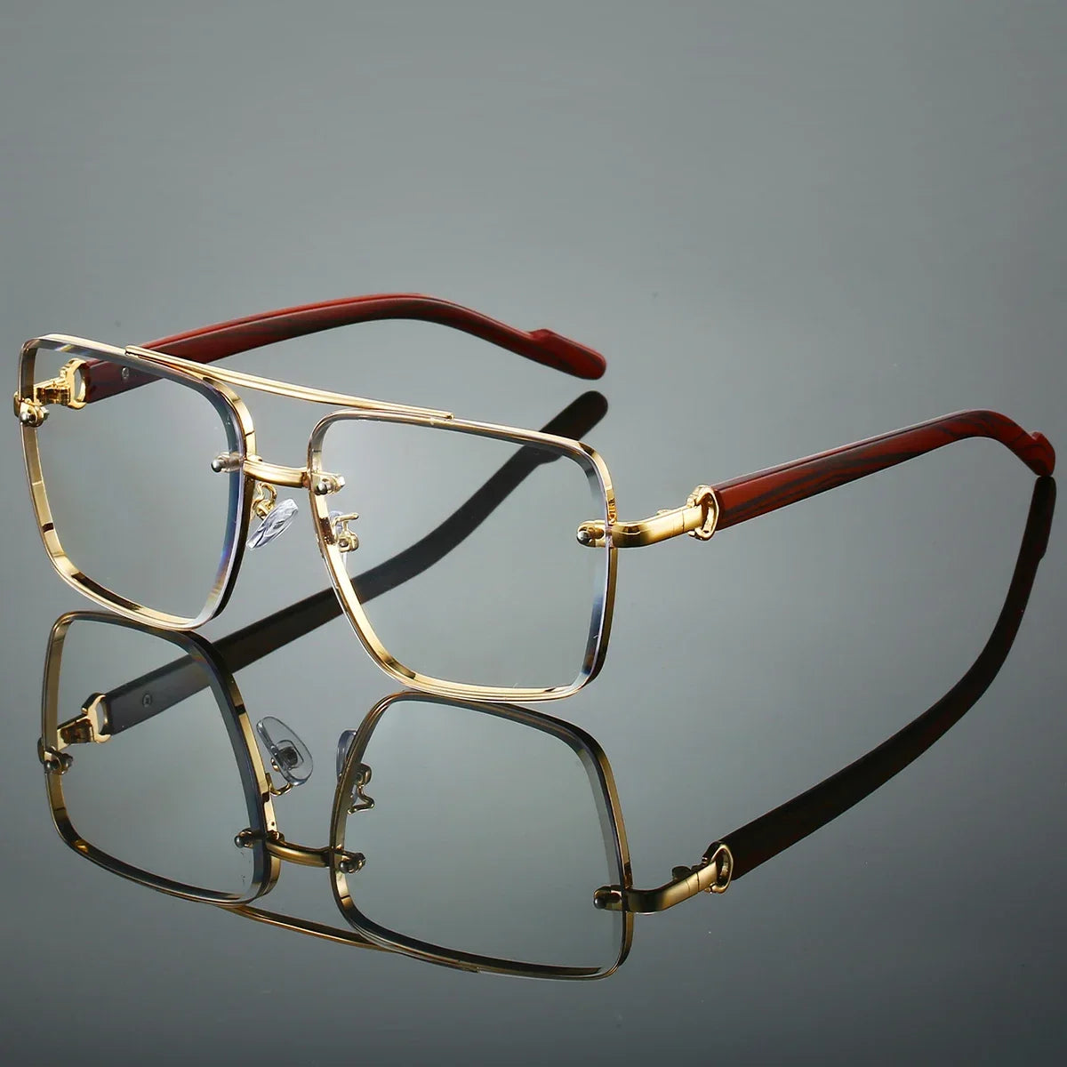 Retro square metal optical glasses with double bridge, clear lenses, and wood temples reflecting on a dark surface.