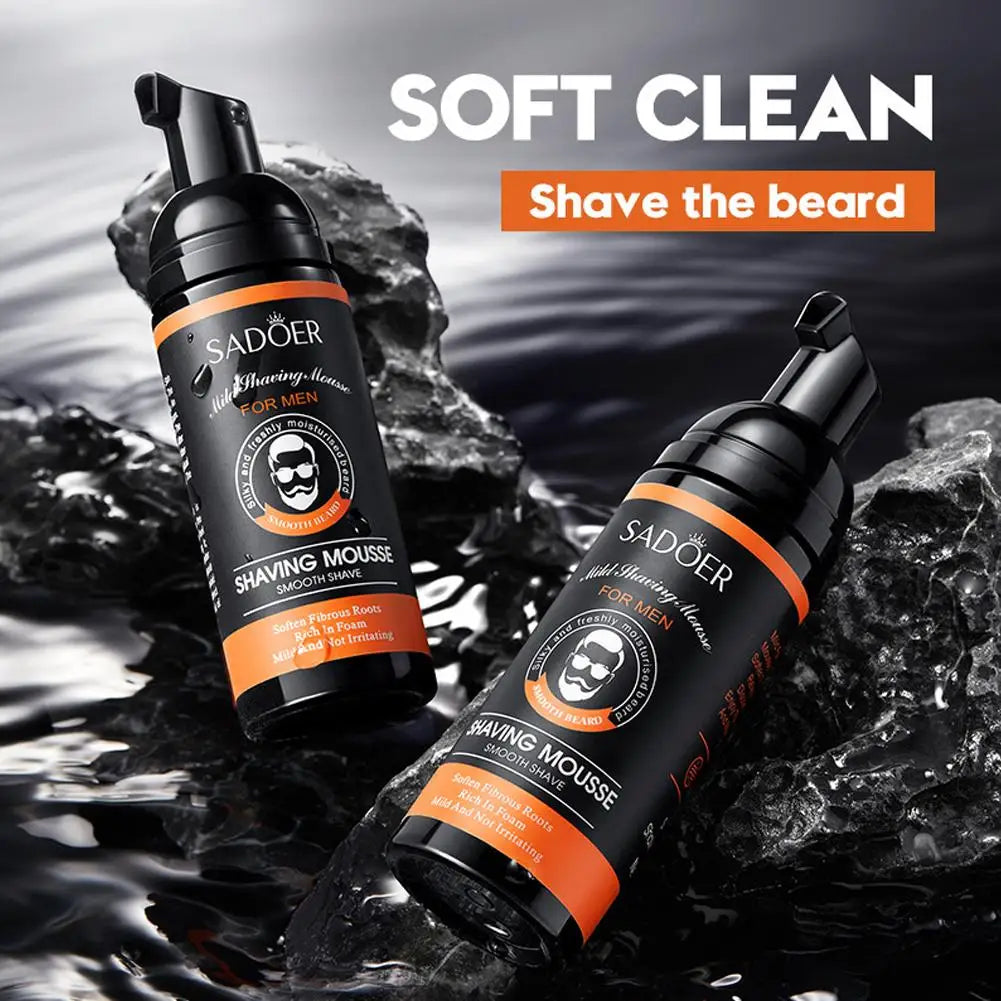 Two bottles of Sadoer mild shaving mousse resting dynamically over dark, splashing water ripples with Soft Clean graphic text
