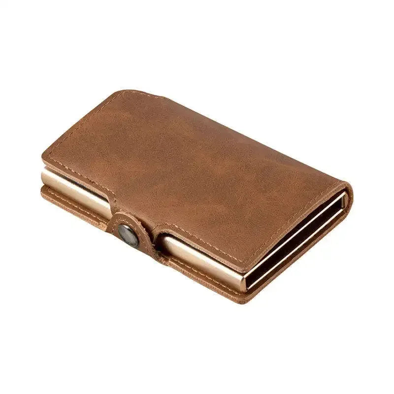 Minimalist pop-up credit card holder wallet wrapped in vintage tan brown split leather with an integrated silver aluminum chamber