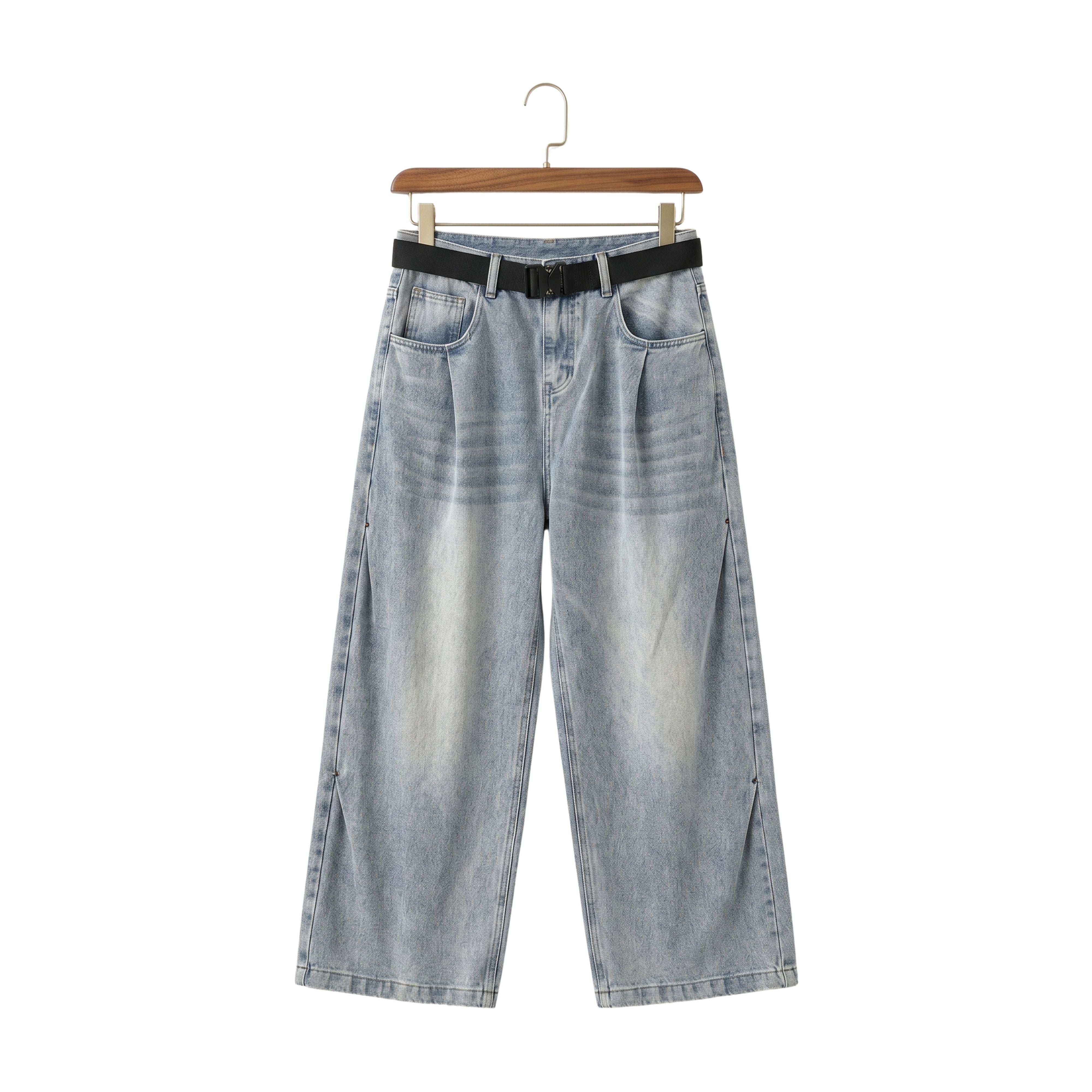 Retro style loose straight-leg jeans in a light blue shade with a matching black leather styling belt