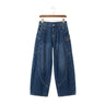 THE CREW unisex Y2K baggy jeans in medium wash denim featuring bold contrast curved seams and an oversized high-street cut